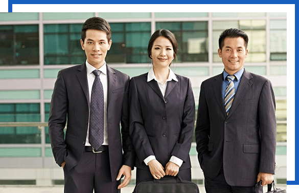 Three people in suits and ties standing next to each other.